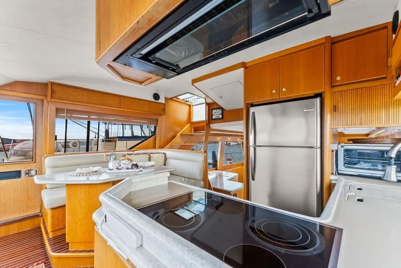 Slide: The Image of Luxurious interior of 2000 West Bay 58 Sonship yacht with modern kitchen amenities. - 13