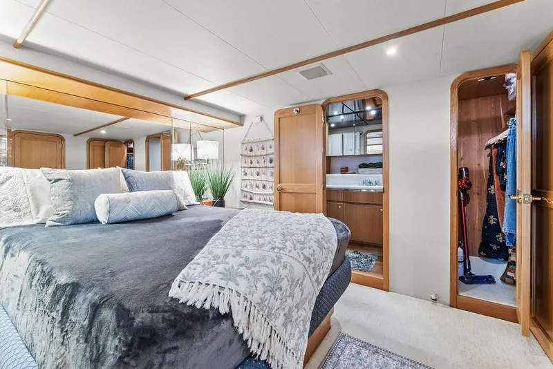 Slide: The Image of Luxurious bedroom interior of 2000 West Bay 58 Sonship yacht with elegant decor and ensuite bathroom. - 18