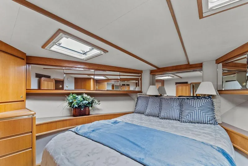 Slide: The Image of Luxurious bedroom interior of 2000 West Bay 58 Sonship yacht with elegant decor. - 24