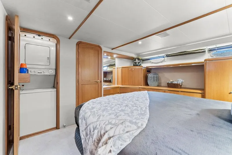 Slide: The Image of Interior of 2000 West Bay 58 Sonship yacht with bedroom and laundry area. - 25