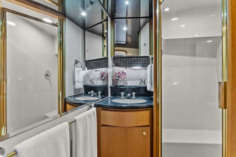 Slide: The Image of Luxurious bathroom in 2000 West Bay 58 Sonship yacht with dual sinks and elegant decor. - 26