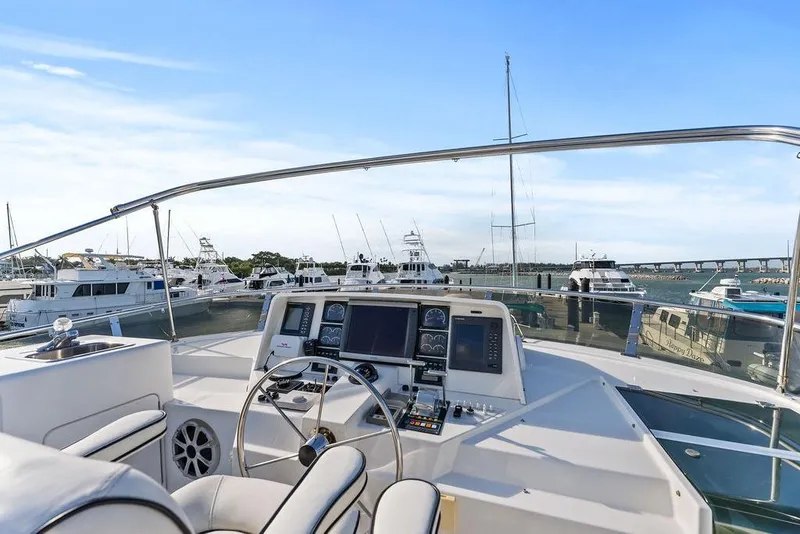 Slide: The Image of Cockpit view of 2000 West Bay 58 Sonship yacht docked in marina. - 34