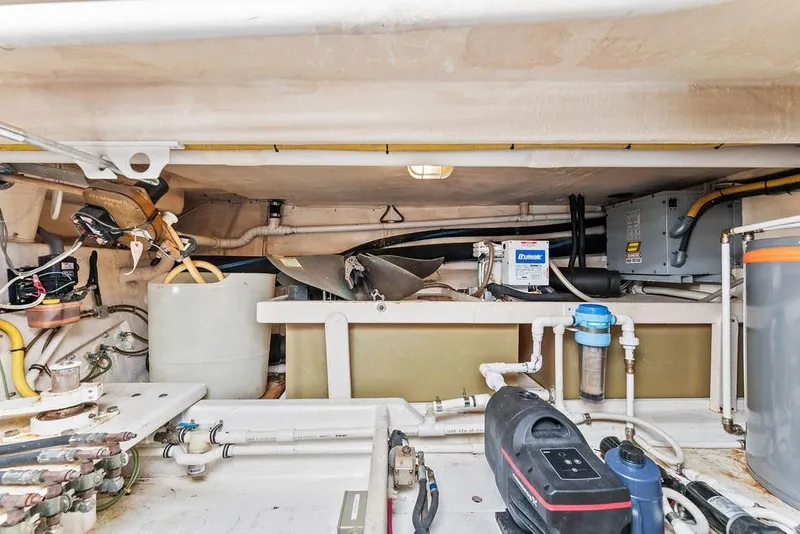 Slide: The Image of Engine room of 2000 West Bay 58 Sonship yacht, showcasing mechanical components and equipment. - 40