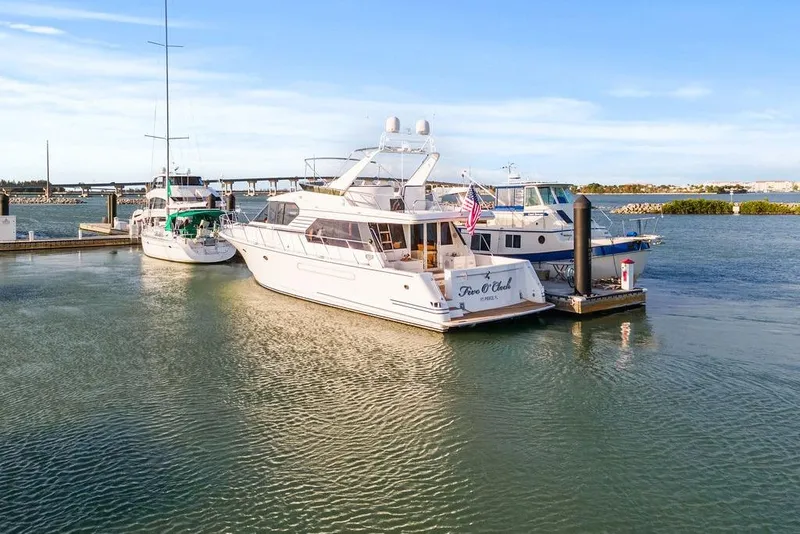 Slide: The Image of 2000 West Bay 58 Sonship yacht docked at marina, sunny day. - 6