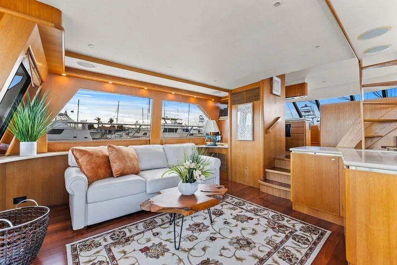 Slide: The Image of Luxurious interior of 2000 West Bay 58 Sonship yacht with elegant decor and large windows. - 8