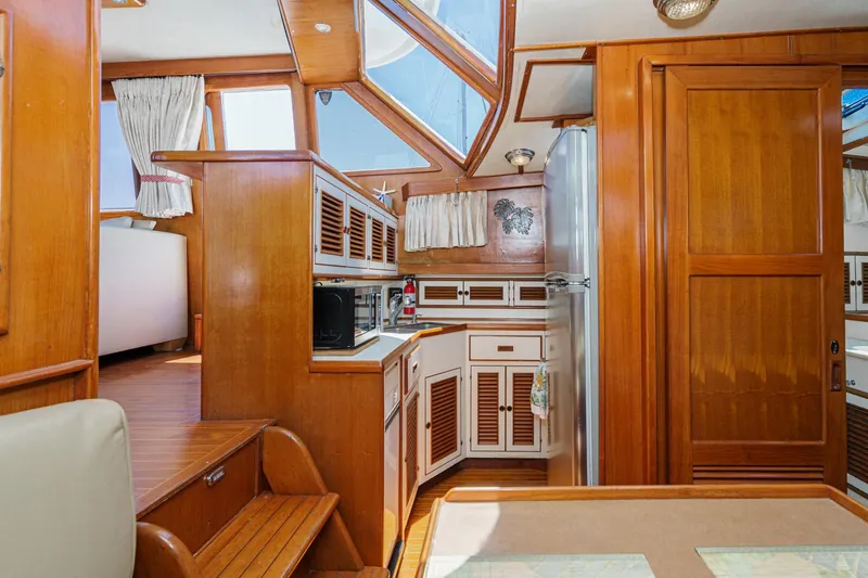 Slide: The Image of Interior of a 1986 Offshore Yachts Cockpit Motoryacht with wooden finish. - 17