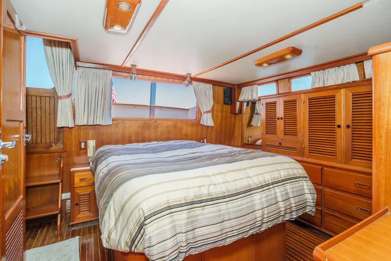 Slide: The Image of Interior of a 1986 Offshore Yachts Cockpit Motoryacht with wooden furnishings. - 23
