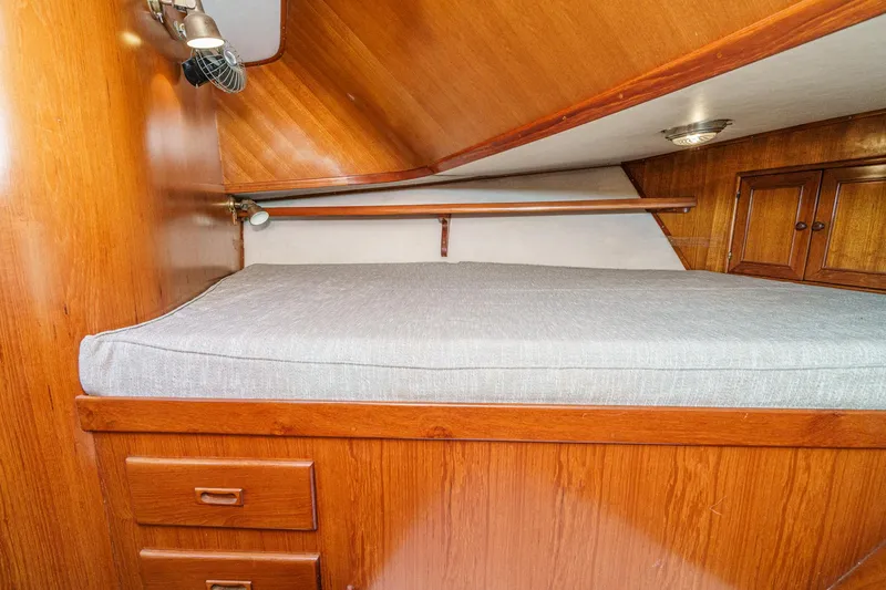 Slide: The Image of Interior of a 1986 Offshore Yachts Cockpit Motoryacht with wooden furnishings. - 27