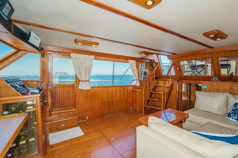 Slide: The Image of Interior of a 1986 Offshore Yachts Cockpit Motoryacht with wooden decor. - 10