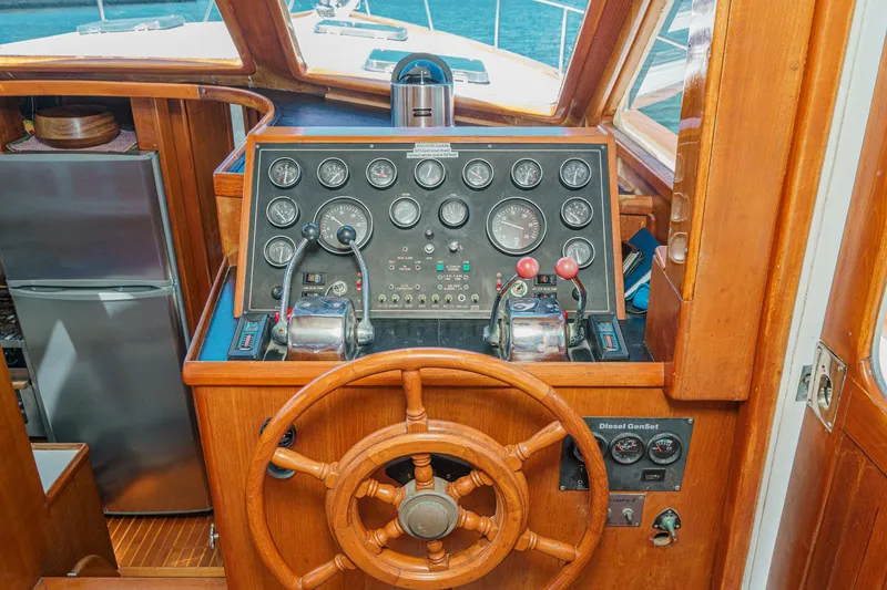 Slide: The Image of Helm of a 1986 Offshore Yachts Cockpit Motoryacht with wooden finish. - 12