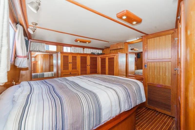 Slide: The Image of Interior of a 1986 Offshore Yachts Cockpit Motoryacht with wooden furnishings. - 24