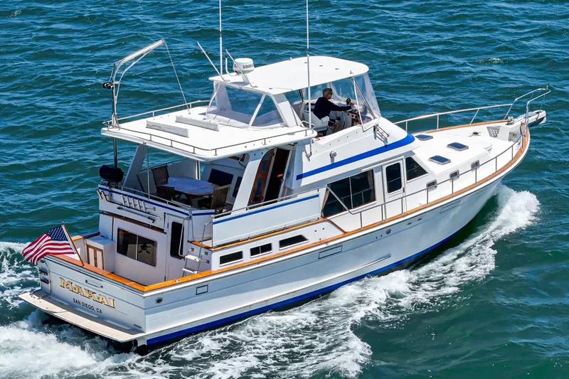 Slide: The Image of 1986 Offshore Yachts Cockpit Motoryacht cruising on the sea. - 3