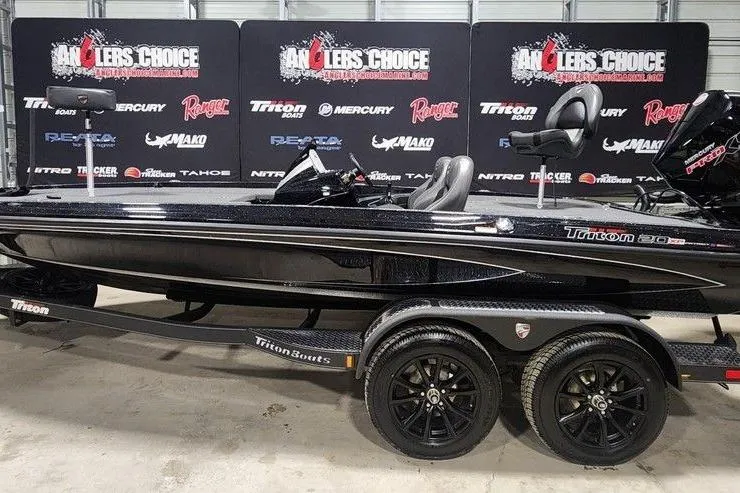 Slide: The Image of 2026 Triton 20XP Patriot bass boat on display at Anglers Choice event. - 1