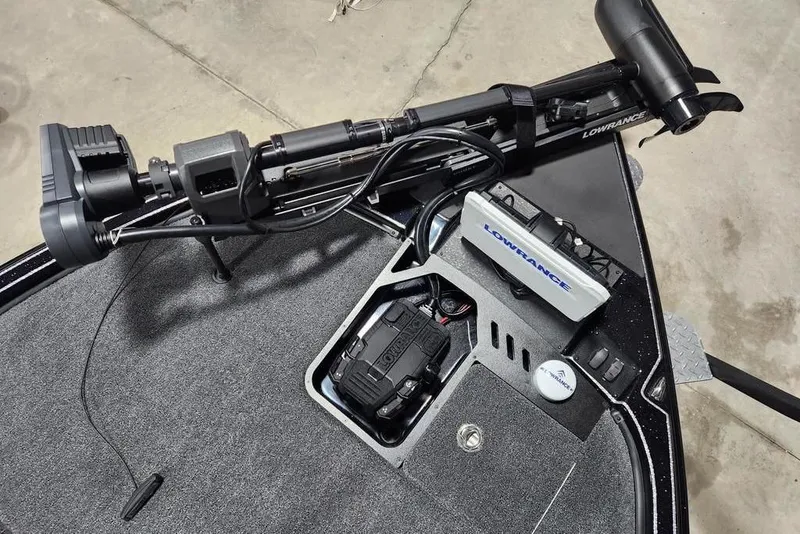 Slide: The Image of 2026 Triton 20XP Patriot boat with advanced Lowrance electronics and trolling motor. - 11