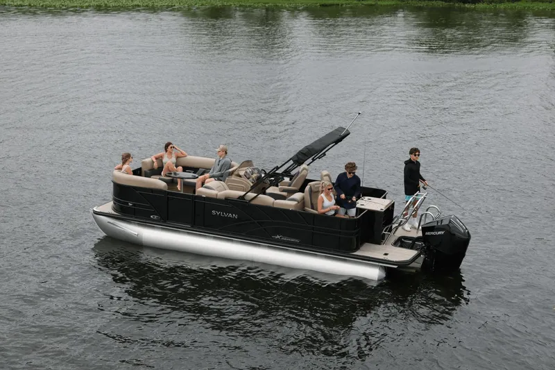 Slide: The Image of 2026 Sylvan Mirage X3 Party Fish pontoon boat on the water. - 4