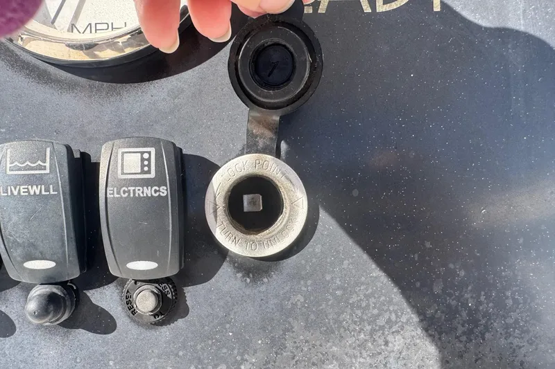 Slide: The Image of Dashboard controls of a 2001 Sea Fox 195 Bay Fisher boat, featuring livewell and electronics switches. - 10