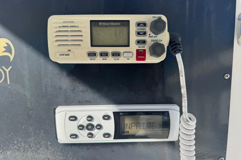 Slide: The Image of VHF radio and control panel on 2001 Sea Fox 195 Bay Fisher boat. - 11