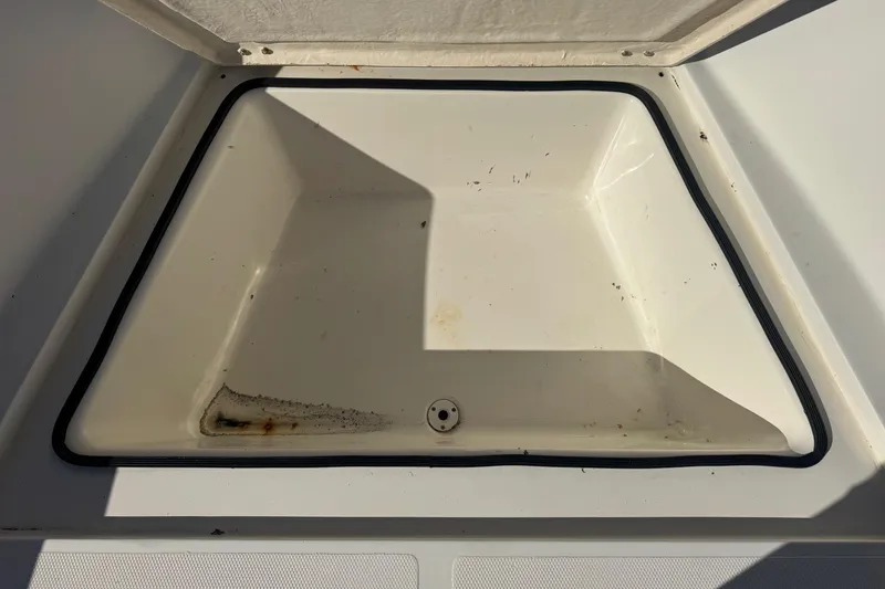 Slide: The Image of Open storage compartment on a 2001 Sea Fox 195 Bay Fisher boat. - 16