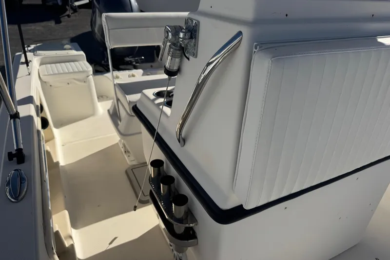 Slide: The Image of 2001 Sea Fox 195 Bay Fisher boat interior with seating and rod holders. - 20