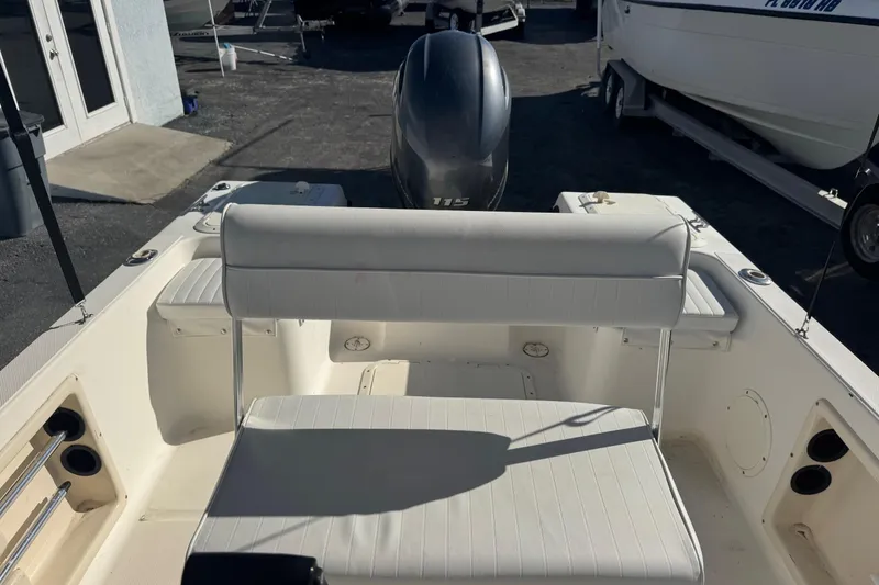 Slide: The Image of 2001 Sea Fox 195 Bay Fisher boat interior with seating and motor. - 21