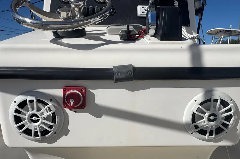 Slide: The Image of Console of 2001 Sea Fox 195 Bay Fisher boat with speakers and control panel. - 22