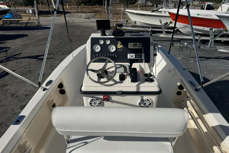 Slide: The Image of 2001 Sea Fox 195 Bay Fisher boat interior with steering console and seating. - 4