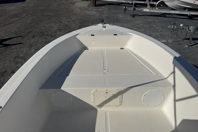 Slide: The Image of 2001 Sea Fox 195 Bay Fisher boat interior, showcasing spacious deck and storage compartments. - 6