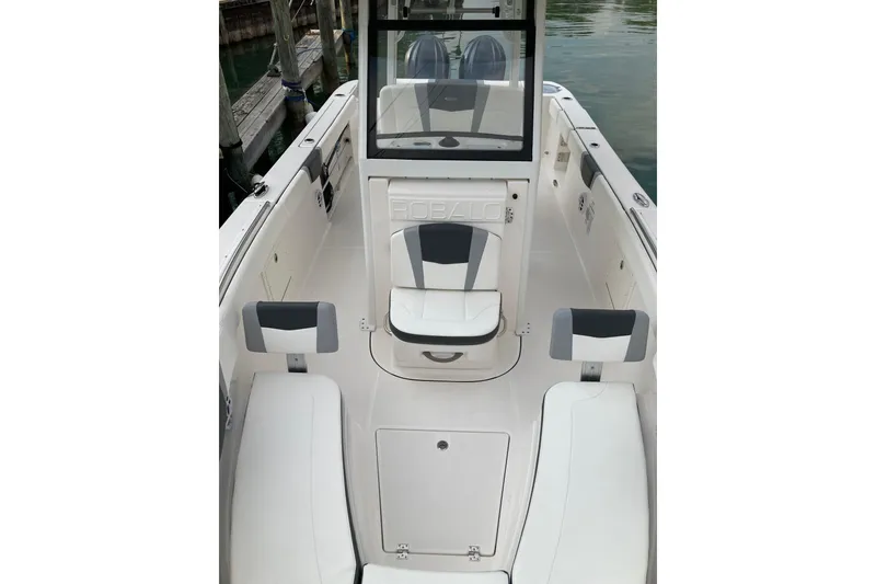 Slide: The Image of 2022 Robalo R272 Center Console boat on a sunny day by the water. - 11