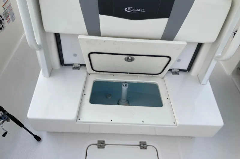 Slide: The Image of 2022 Robalo R272 Center Console boat in storage, covered and elevated indoors. - 20