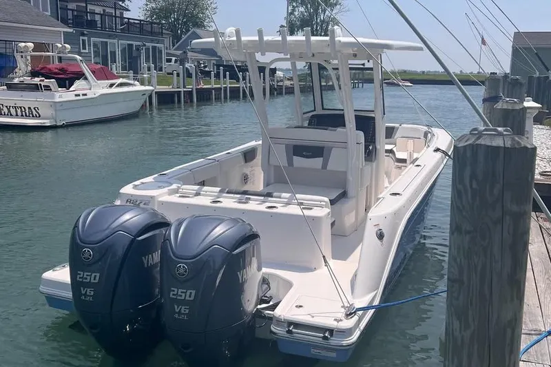 Slide: The Image of 2022 Robalo R272 Center Console boat interior with seating and console view. - 5