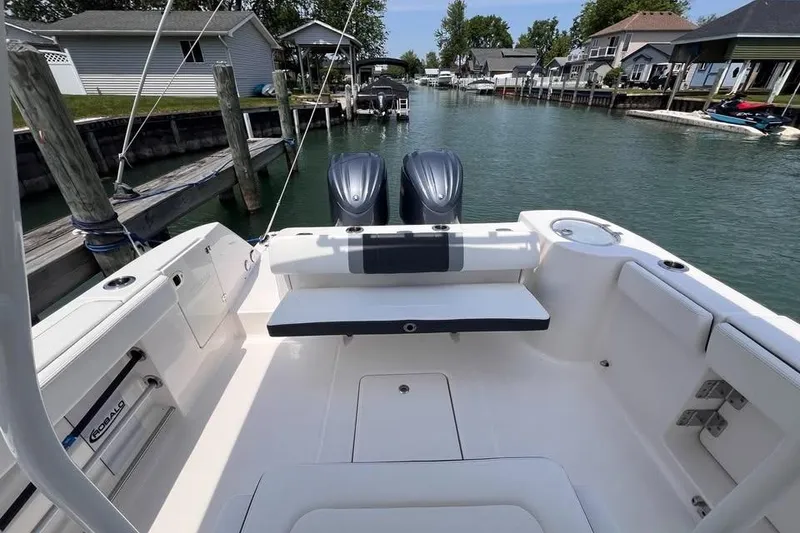 Slide: The Image of 2022 Robalo R272 Center Console boat with open storage compartment. - 8