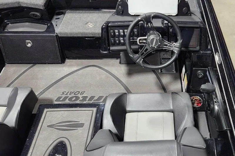 Slide: The Image of Interior of 2026 Tracker Grizzly 12 Jon boat with steering wheel and seating. - 4