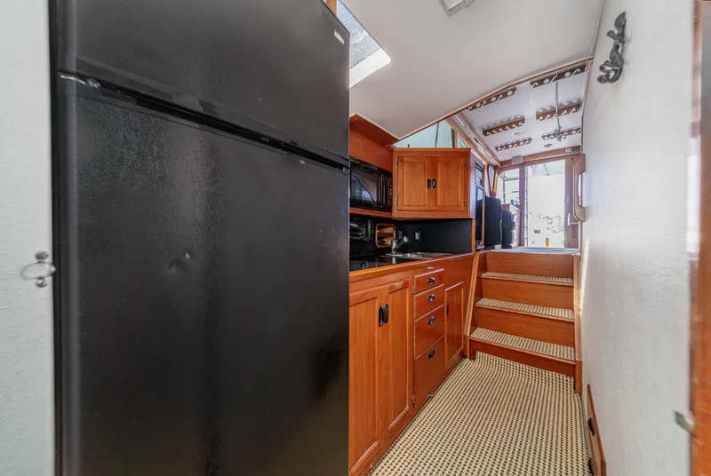 Slide: The Image of Interior of a 1974 Pacemaker Sportfisher yacht with wooden cabinetry. - 15