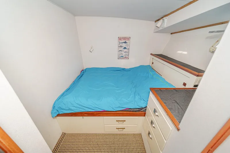 Slide: The Image of Interior of a 1974 Pacemaker Sportfisher with bed and storage. - 19