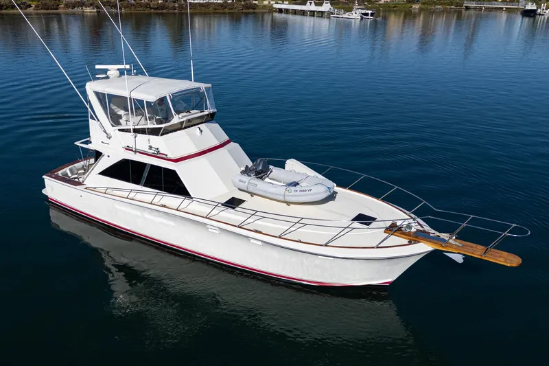 Slide: The Image of 1974 Pacemaker Sportfisher yacht on calm water. - 2