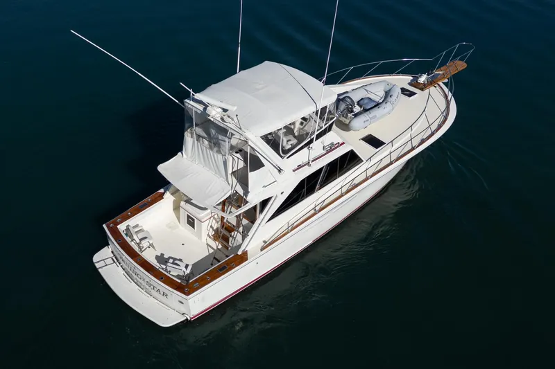 Slide: The Image of Aerial view of a 1974 Pacemaker Sportfisher yacht on calm water. - 3