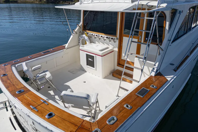 Slide: The Image of 1974 Pacemaker Sportfisher with wooden trim and fishing chairs. - 4