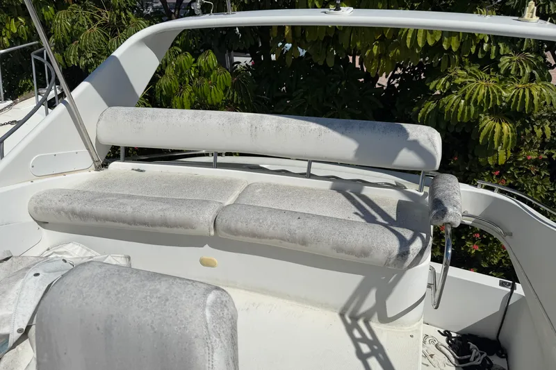 Slide: The Image of Interior of 2003 Carver 360 Sport Sedan with beige leather seating and wooden cabinetry. - 11