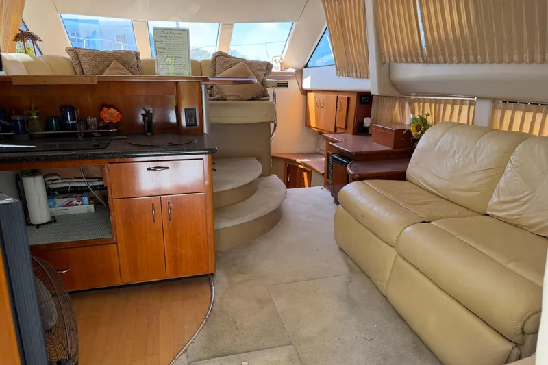 Slide: The Image of Interior of 2003 Carver 360 Sport Sedan with modern amenities and cozy seating. - 12
