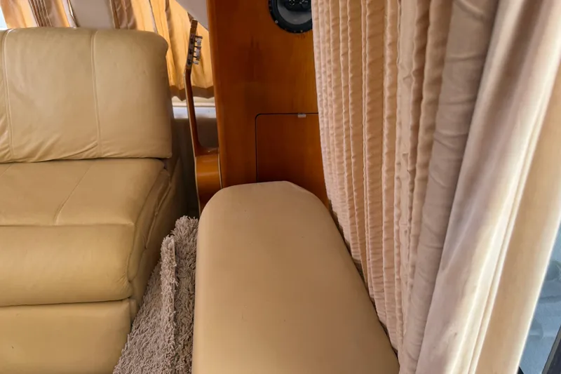 Slide: The Image of Interior of 2003 Carver 360 Sport Sedan with TV, cabinets, and countertop. - 15