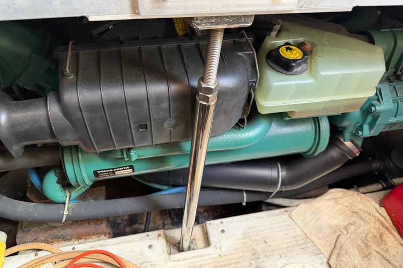 Slide: The Image of Engine compartment of a 2003 Carver 360 Sport Sedan boat, showcasing mechanical components. - 31