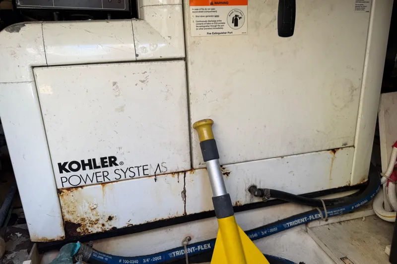 Slide: The Image of Control panel of a 2003 Carver 360 Sport Sedan with hour meter and circuit breakers. - 35