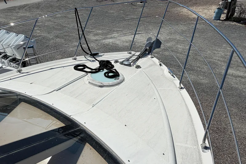 Slide: The Image of 2003 Carver 360 Sport Sedan boat with large front windows and sleek design. - 37