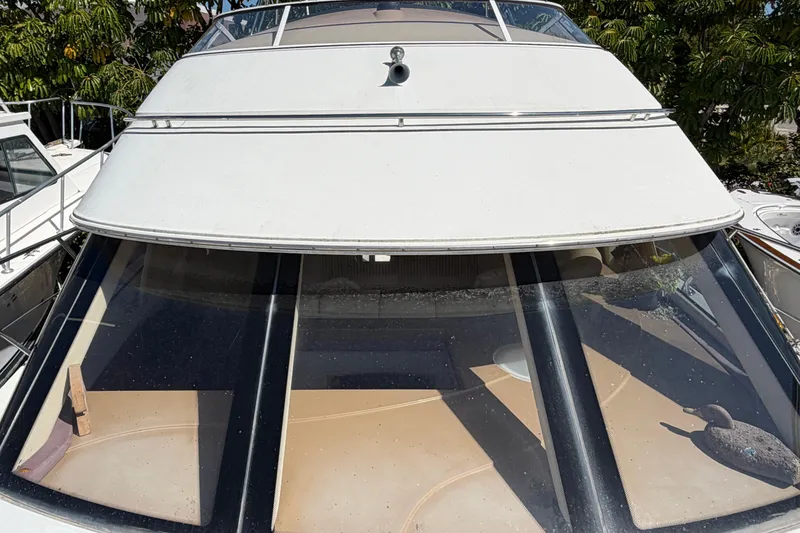 Slide: The Image of Dashboard of 2003 Carver 360 Sport Sedan with RPM gauge and switches. - 38