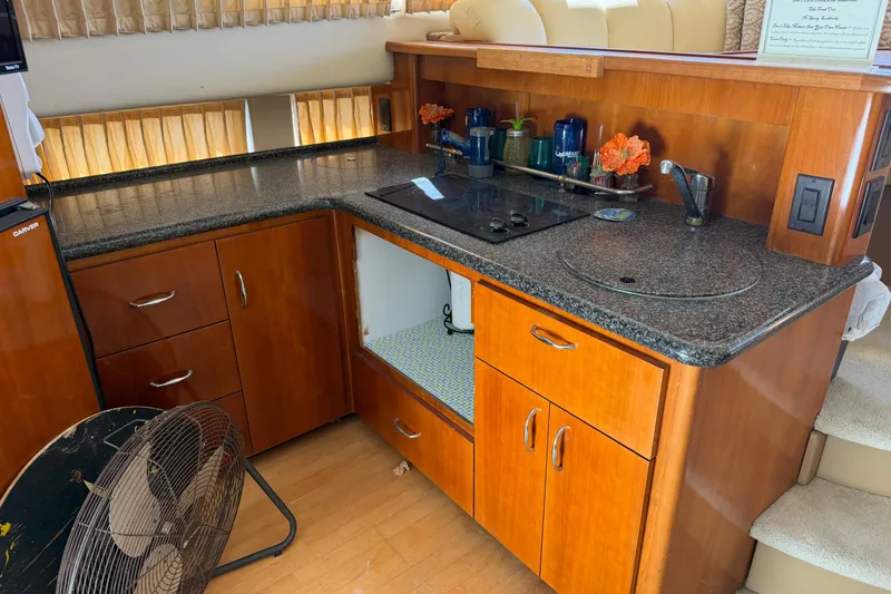 Slide: The Image of Interior of 2003 Carver 360 Sport Sedan with cozy seating and wooden table. - 17