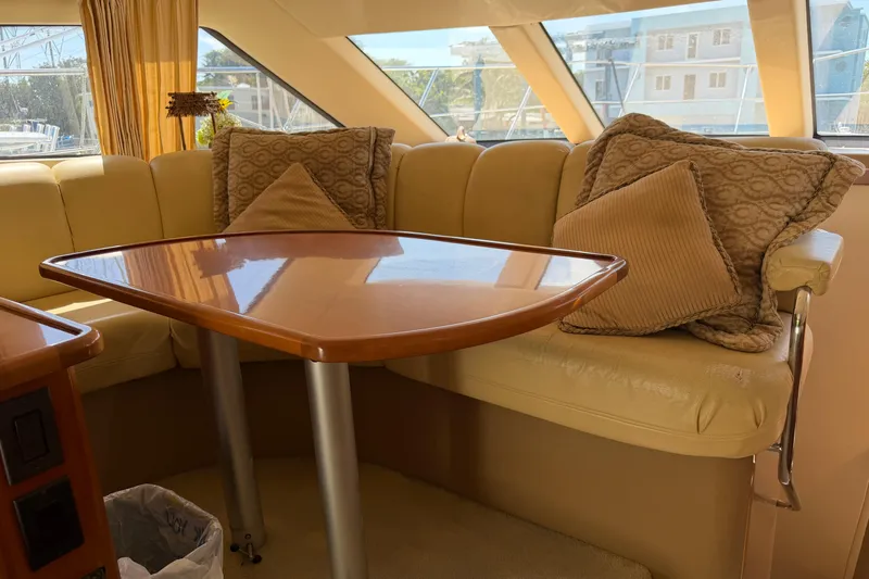 Slide: The Image of Interior of 2003 Carver 360 Sport Sedan with wooden cabinetry and mini fridge. - 18