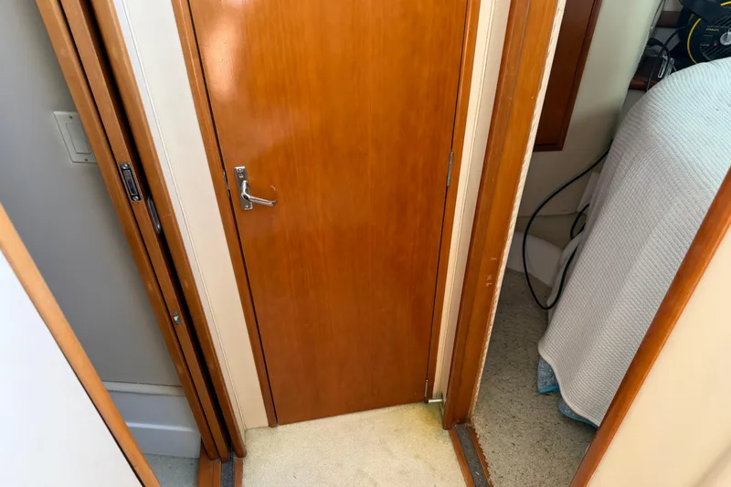 Slide: The Image of Cozy cabin bed with floral bedding in 2003 Carver 360 Sport Sedan. - 21