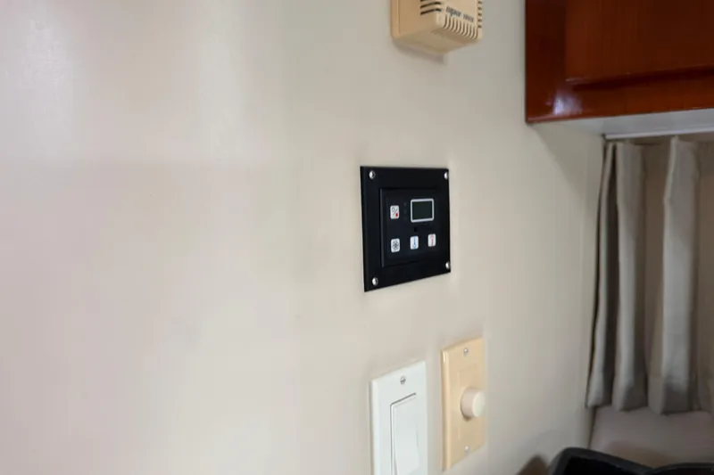 Slide: The Image of 2003 Carver 360 Sport Sedan bathroom with shower, toilet, and black countertop sink. - 28