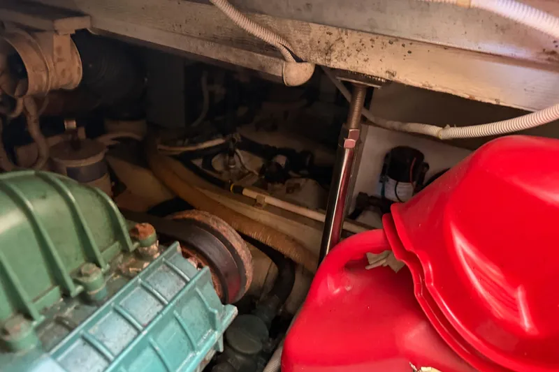 Slide: The Image of 2003 Carver 360 Sport Sedan engine room with Kohler power system and paddle. - 34