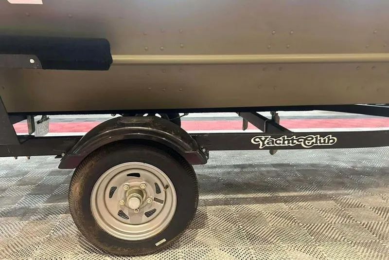 Slide: The Image of 2024 Lowe L1448 Jon boat on Yacht Club trailer, side view. - 11